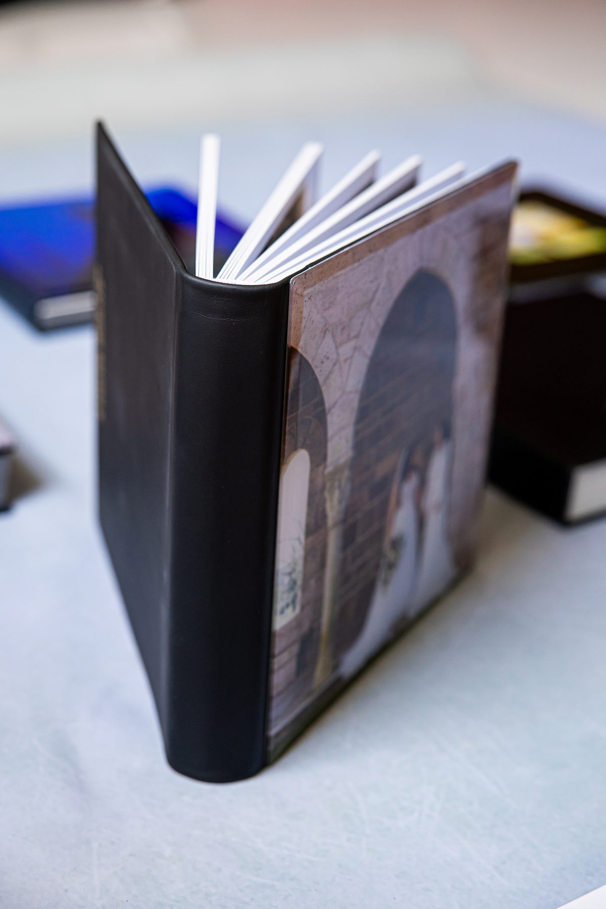 Wedding album standing open showing leather spine